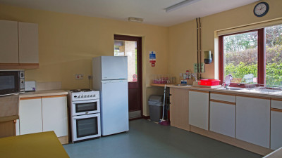 Kitchen view toward exit to outside